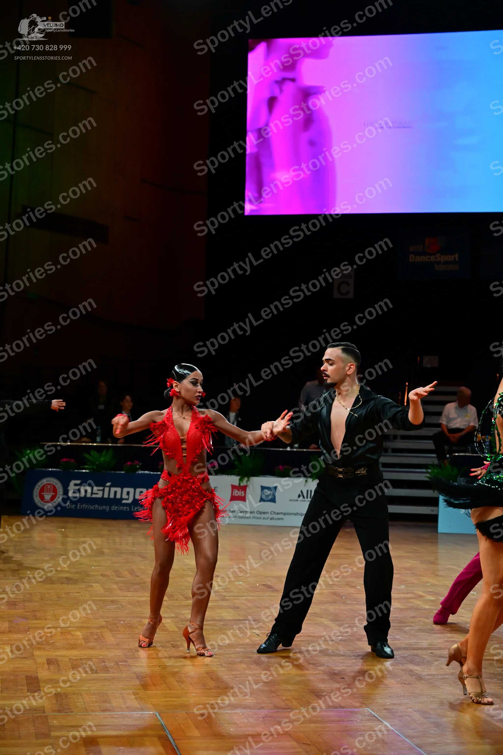 Dancesport competitor: Male dancer: black shirt and black trousers