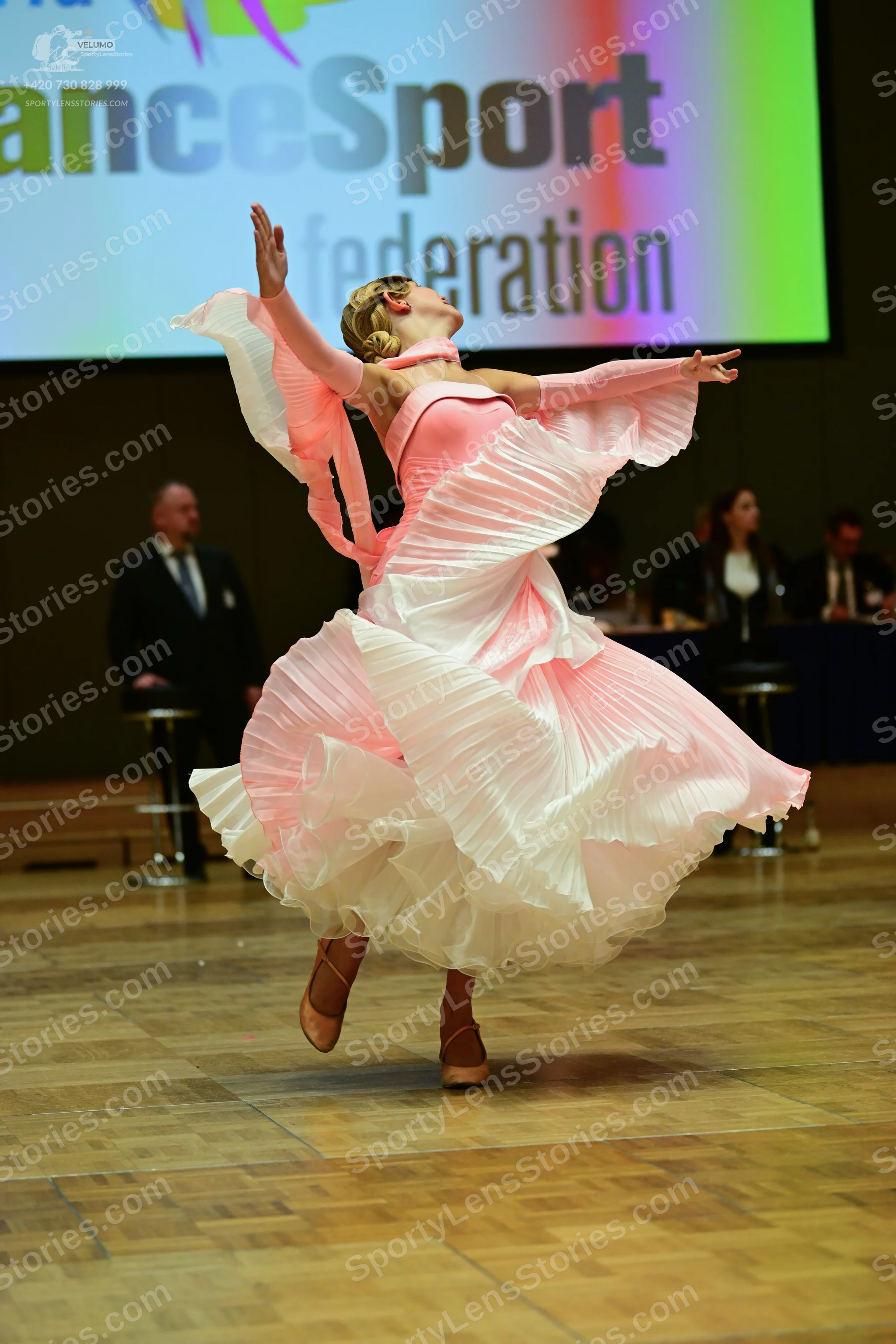 Dancesport competitor: ** Pale pink ballgown
*   **Fabric:** Primarily satin, with a layered, flowing e