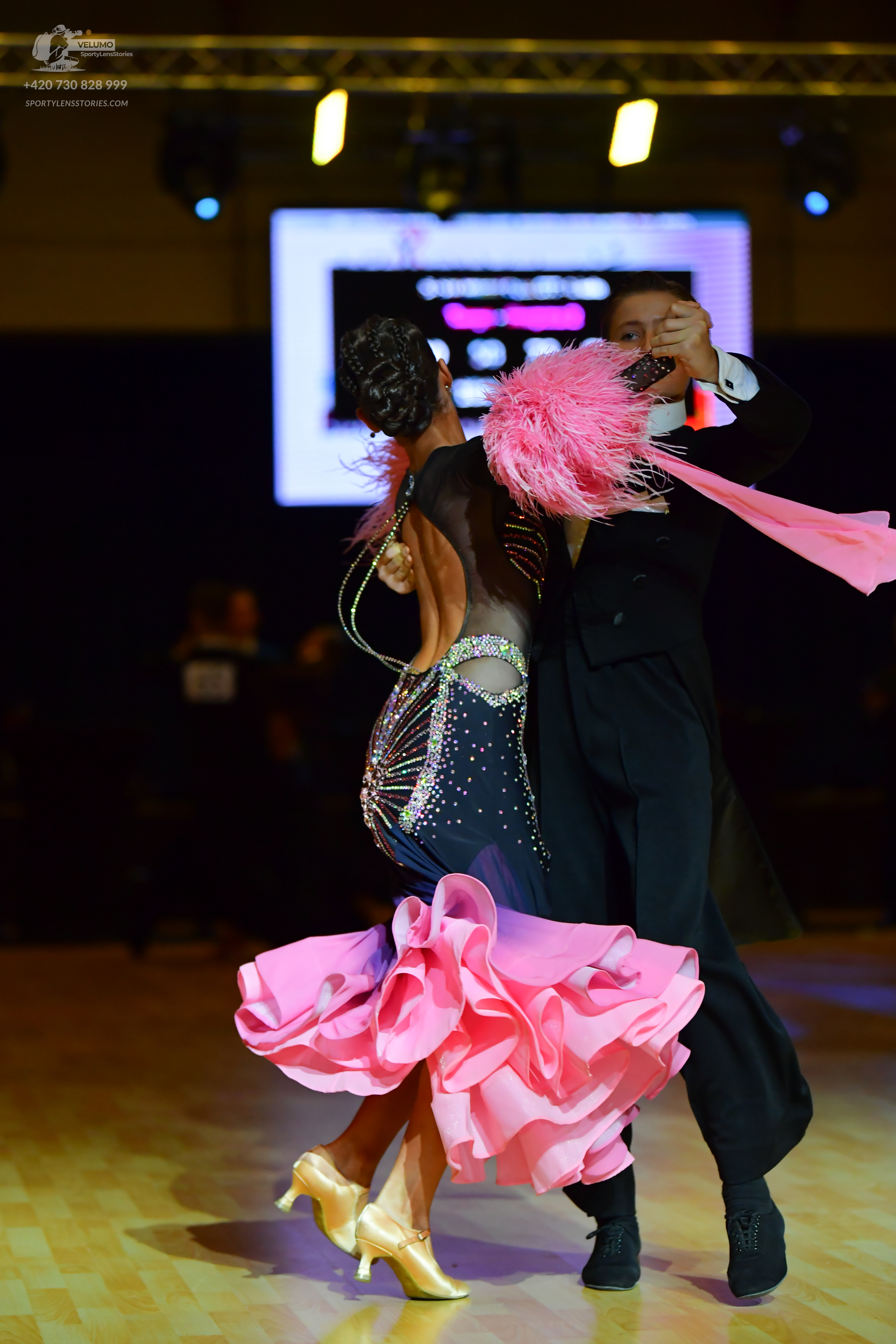 Dancesport competitor: Male dancer: black suit with a white shirt and black dance shoes