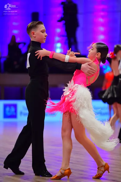 Dancesport competitor: Male dancer: black long-sleeved top and black trousers