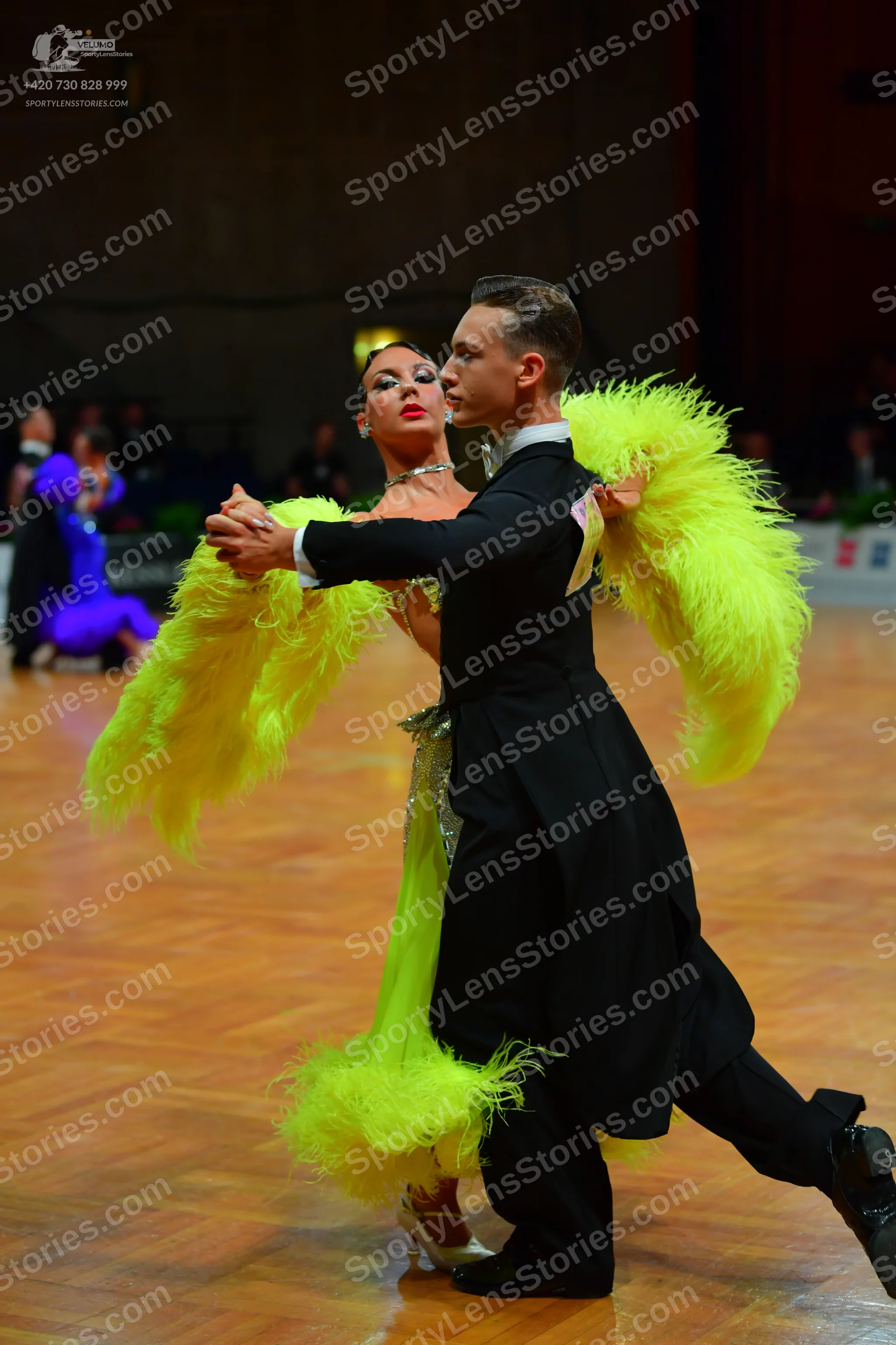 Dancesport competitor: Male dancer: black ballroom tailcoat, black trousers, and black dance shoes