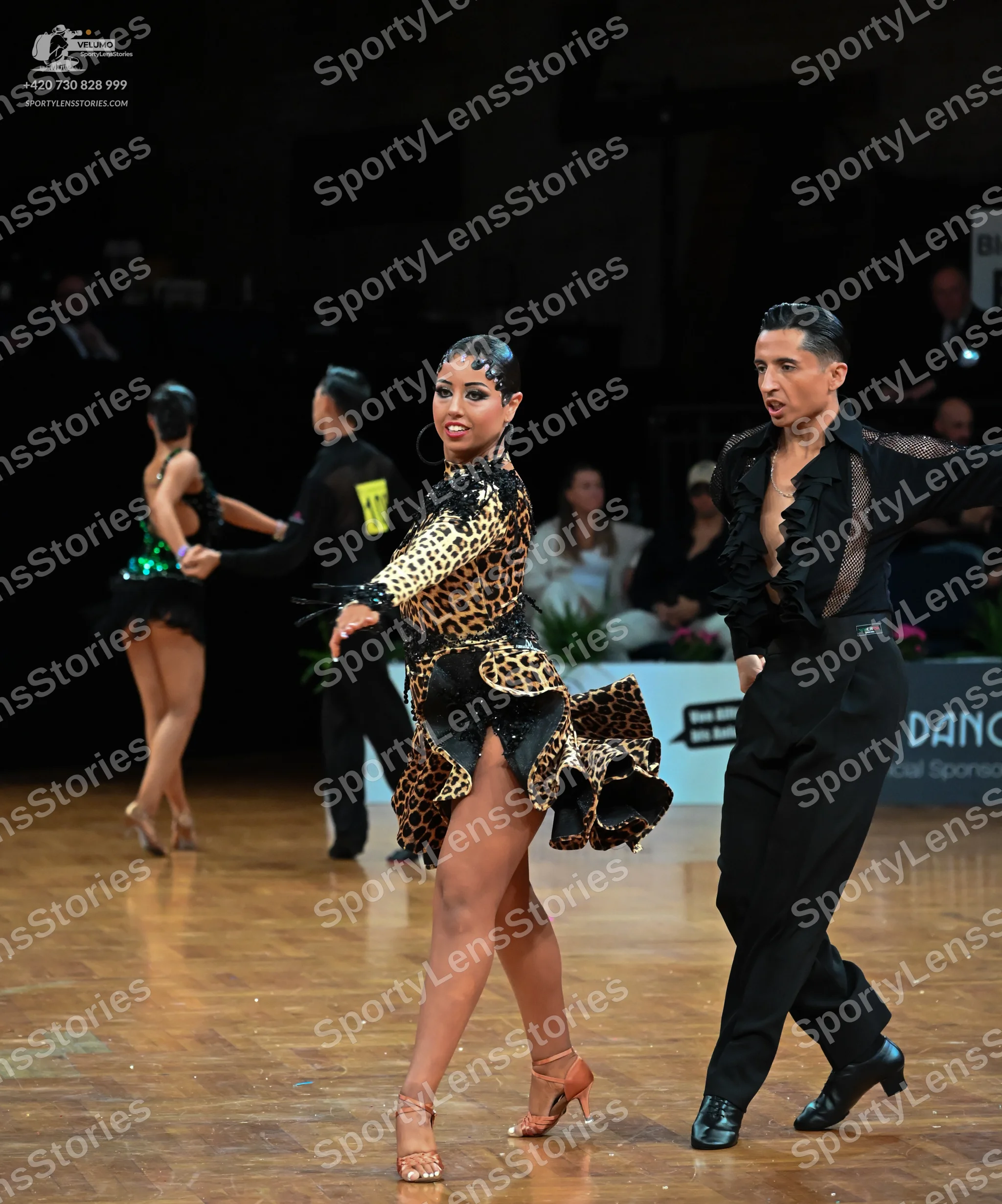 Dancesport competitor: Male dancer (front): black latin dance shirt with black sequins on the chest, bl