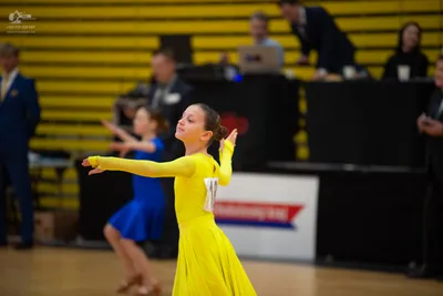 Dancesport competitor: ** Yellow Latin Dress
*   **Color:** Yellow
*   **Fabric:** Satin (appears to be