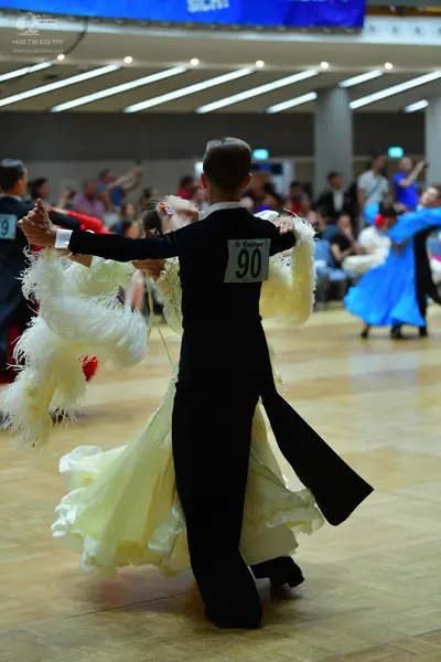 Dancesport competitor #73, #90: Male dancer: black tailcoat