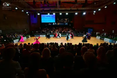 Dancesport competitor: Female dancers: various colorful latin dresses in magenta, light pink, red, dark