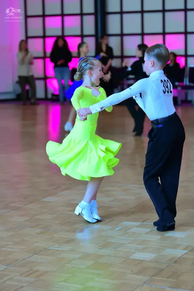 Dancesport competitor #392: Male dancer: white long-sleeved shirt and black trousers