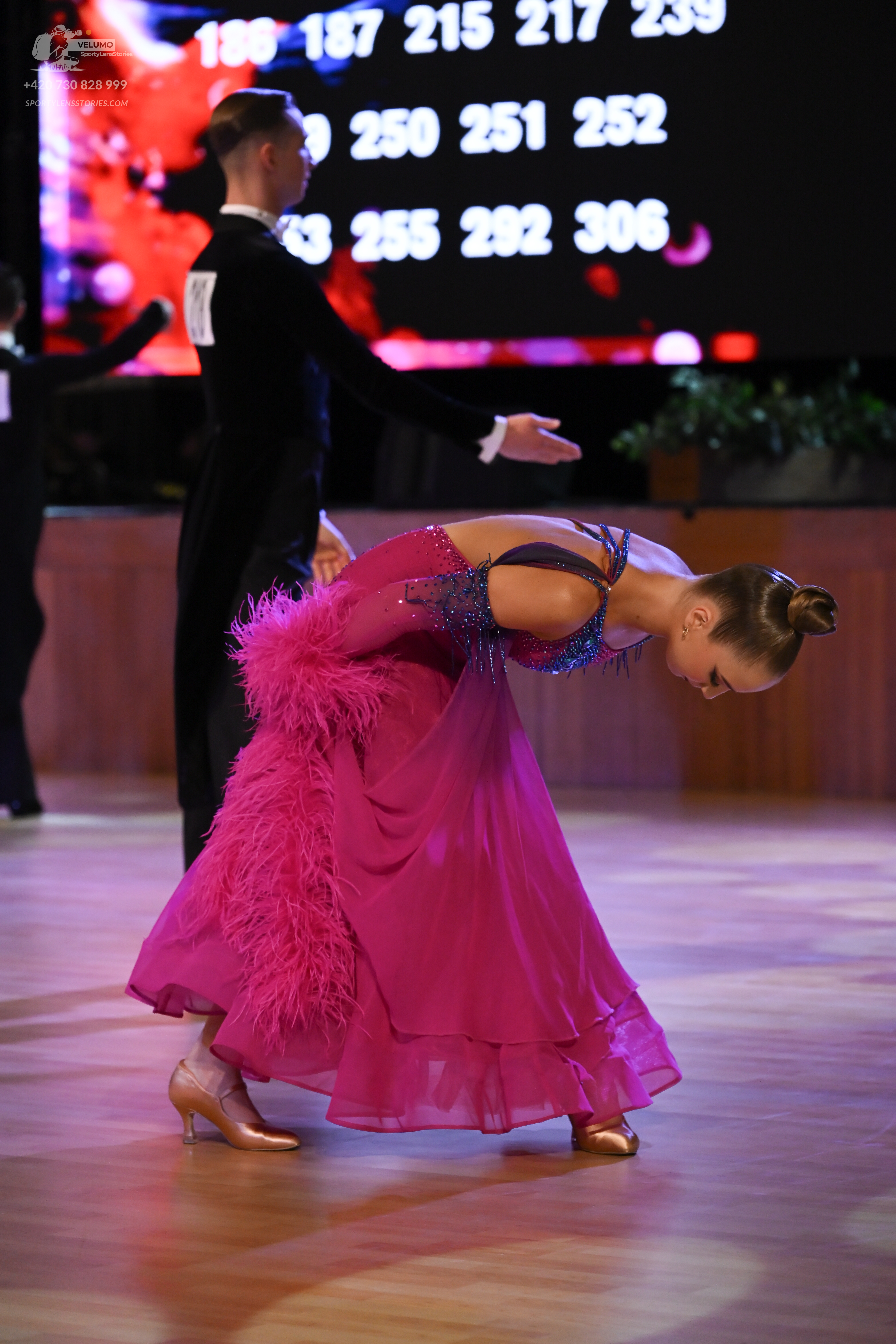Dancesport competitor: Male:** Black tailsuit with sequin lapels
