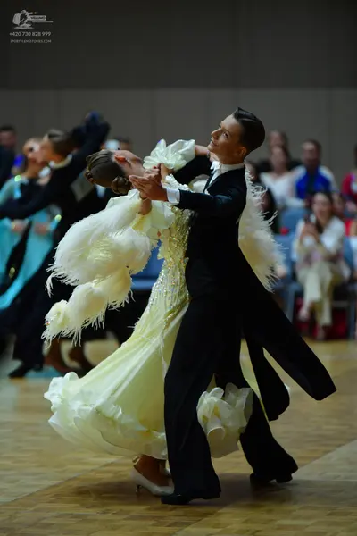 Dancesport competitor: Male dancer: black tailcoat with a white shirt and black bow tie