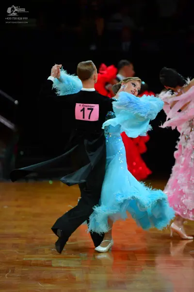 Dancesport competitor: Male dancer: black tailcoat and black trousers