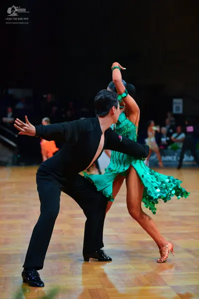 Dancesport competitor: Male dancer: black suit and black dance shoes