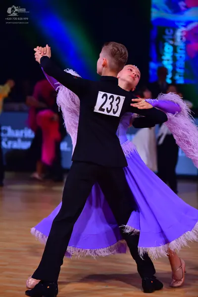Dancesport competitor: Male dancer: black suit