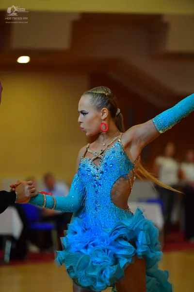 Dancesport competitor: Female dancer: light blue Latin dress with sequins, rhinestones, long sleeves, s