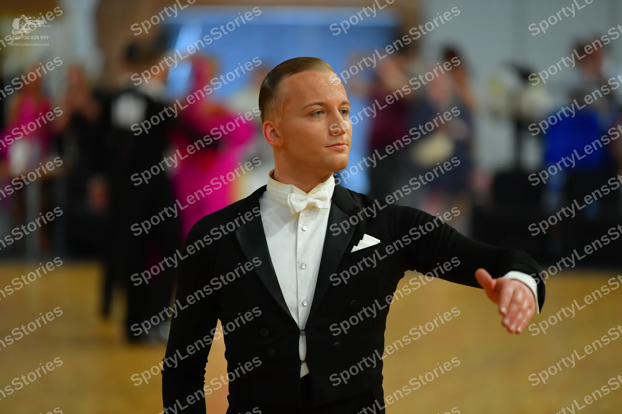 Dancesport competitor: ** Male: Black tailsuit with sequin lapels