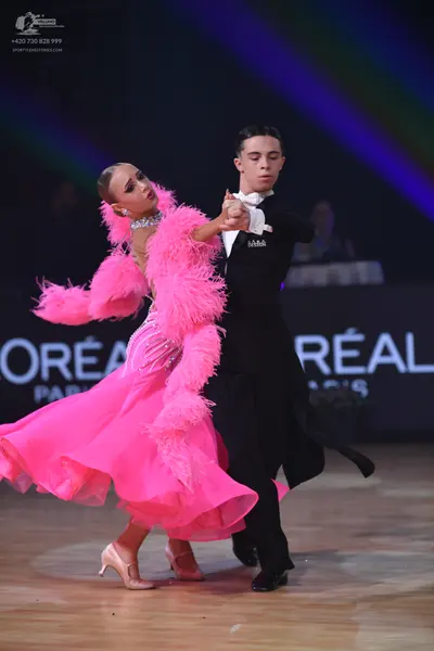 Dancesport competitor: Male dancer: black formal tailcoat with a white shirt and white bow tie