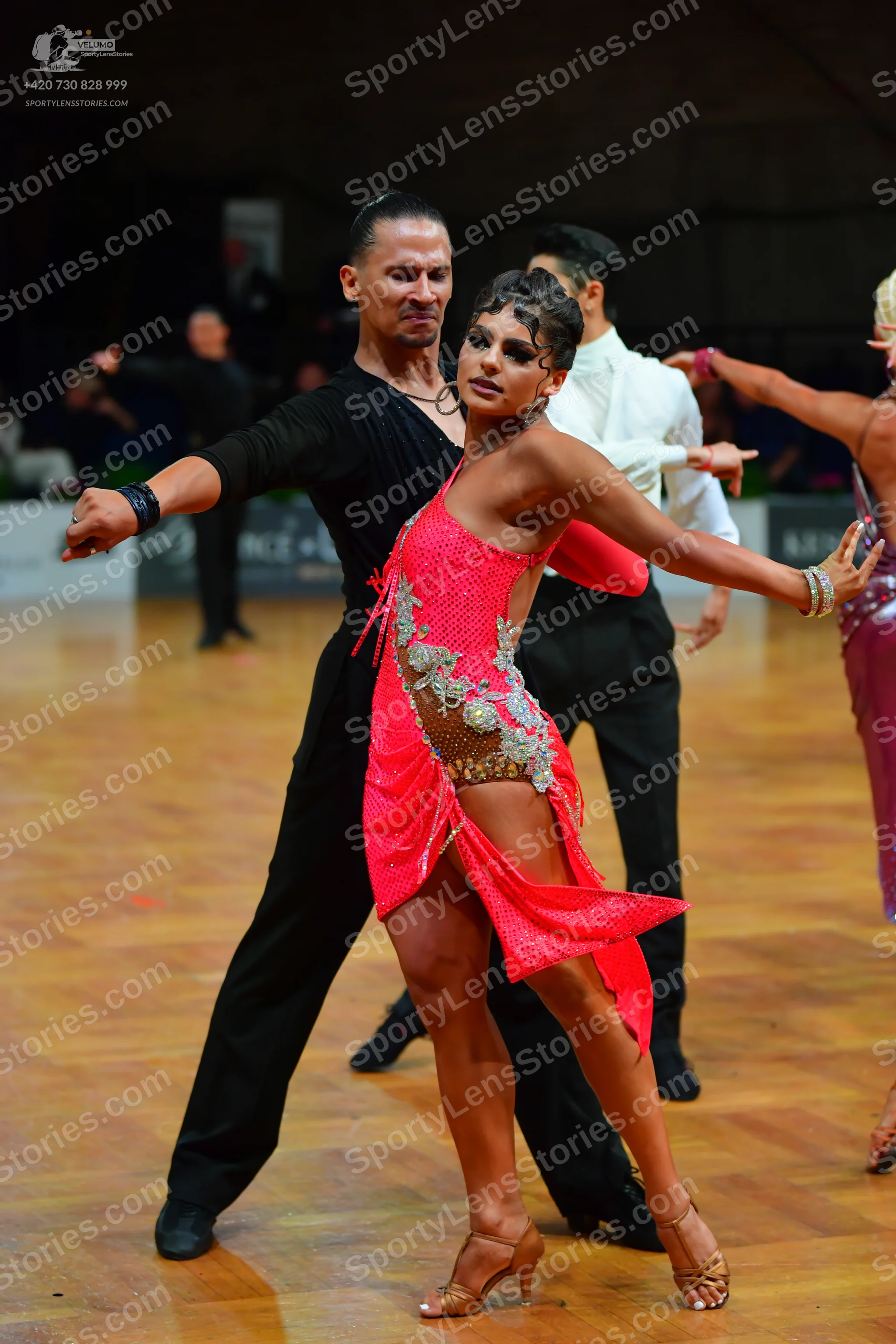 Dancesport competitor: Male dancer: black long-sleeved shirt and black trousers