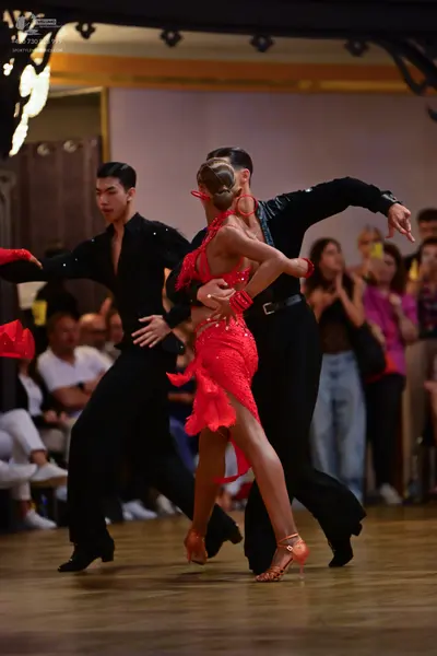 Dancesport competitor: Male dancers: black long-sleeved shirts and black trousers