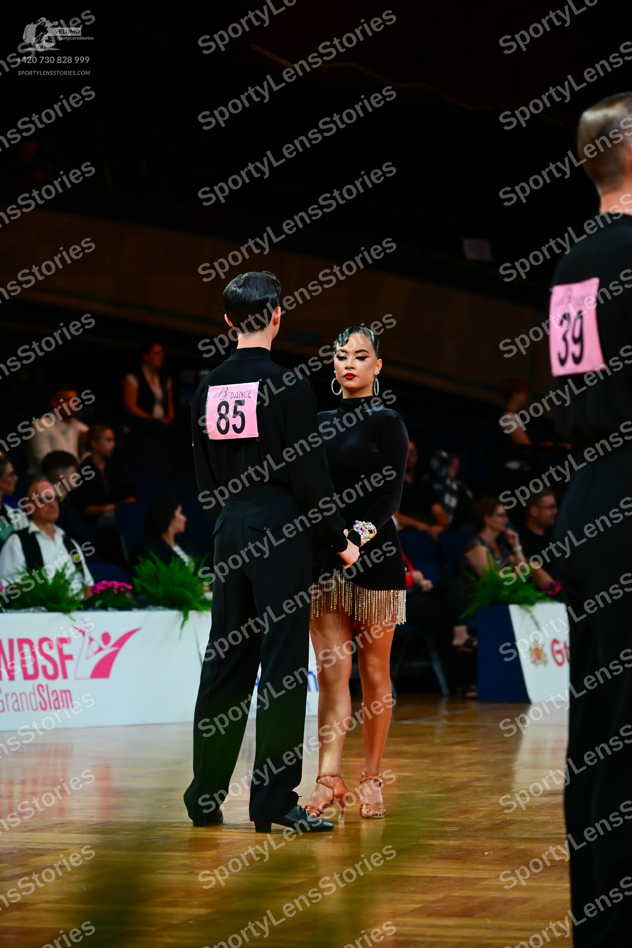 Dancesport competitor #85, #39: Male dancer (85): black long-sleeved shirt and black trousers