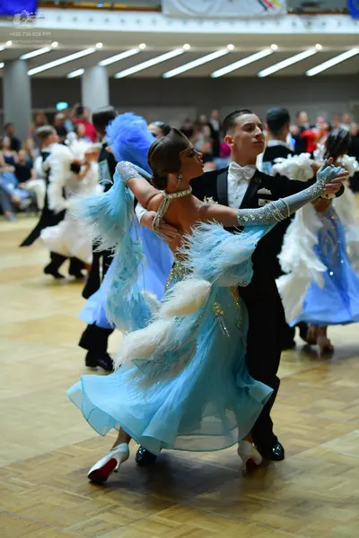 Dancesport competitor: Male dancer: black suit with white shirt and white bowtie