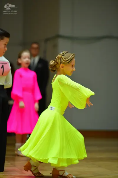 Dancesport competitor: Male dancer: white long-sleeved shirt and black trousers