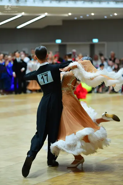 Dancesport competitor #17: Male dancer: black long-sleeved shirt and black trousers