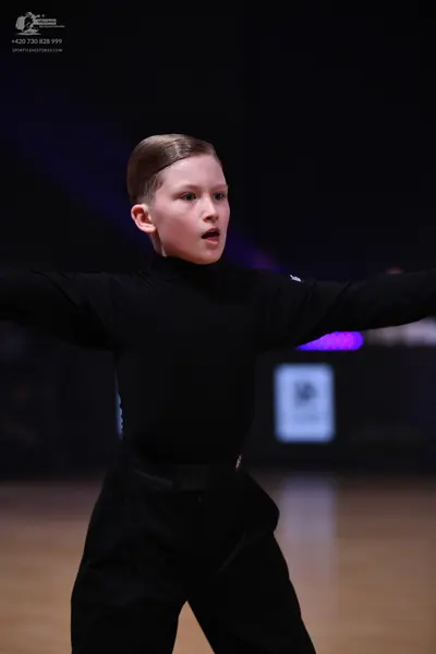 Dancesport competitor: Single dancer: black long-sleeved top and black pants