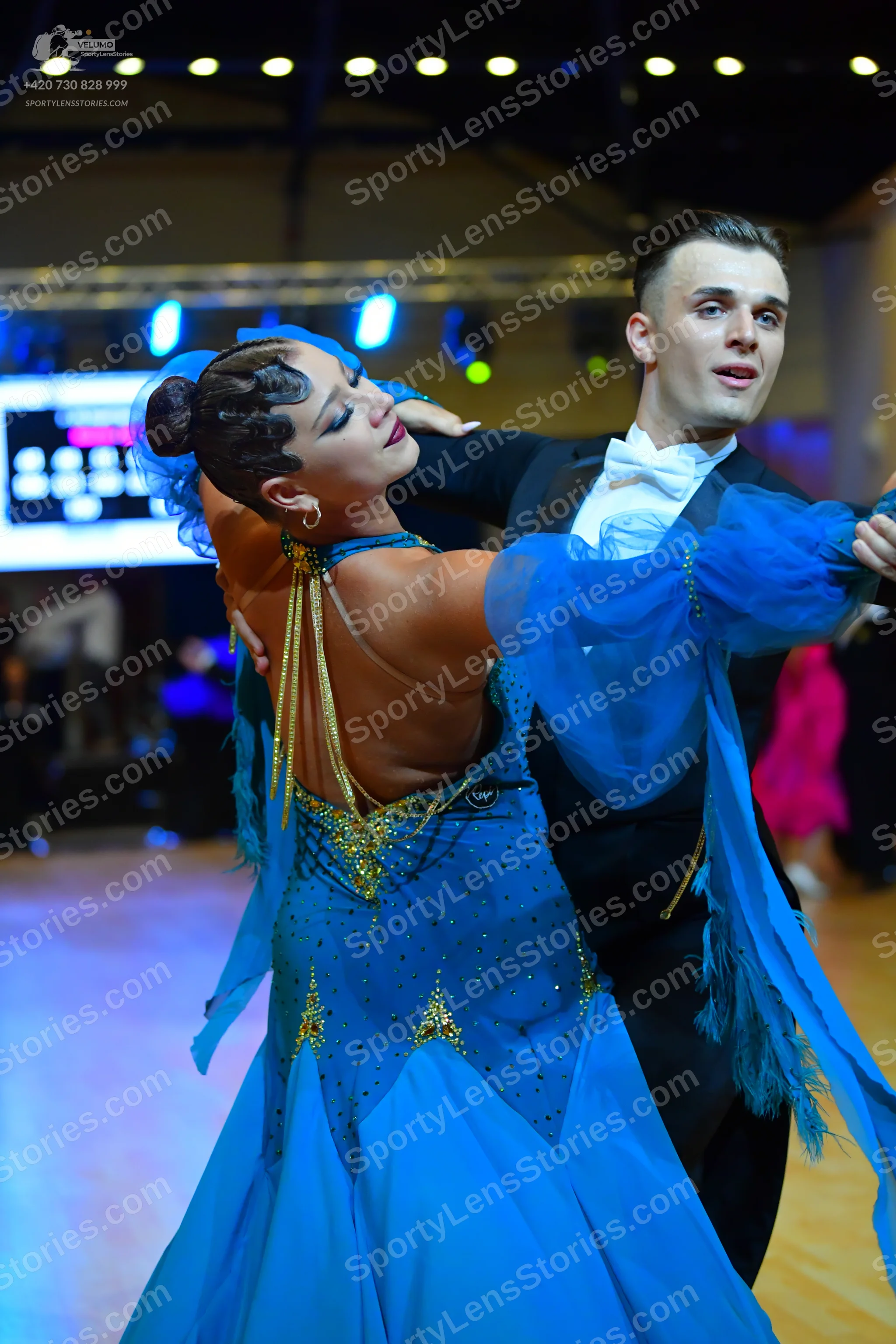 Dancesport competitor: Male dancer: black suit with a white bow tie and white shirt
