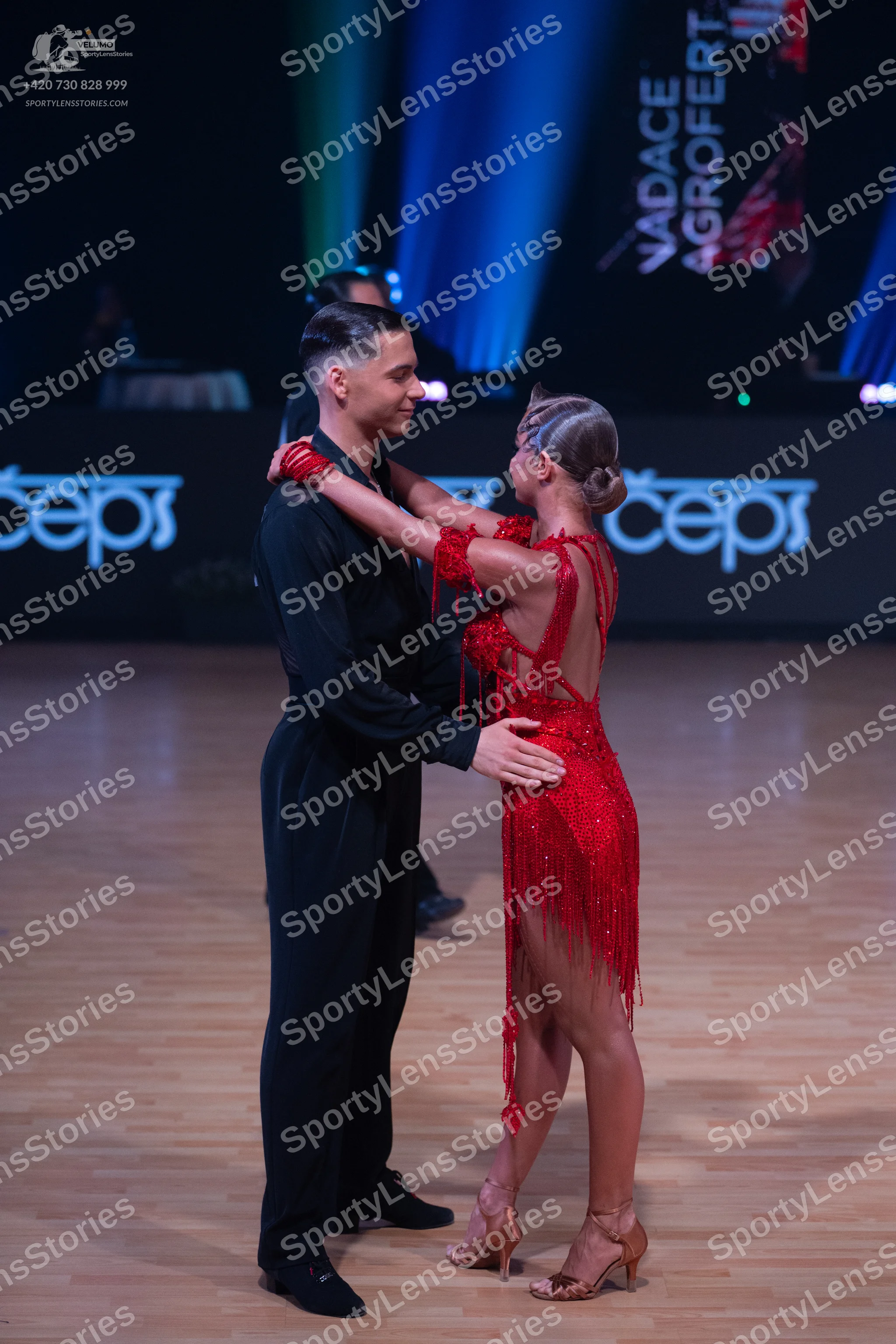 Dancesport competitor: Male dancer: black long-sleeved shirt and black trousers