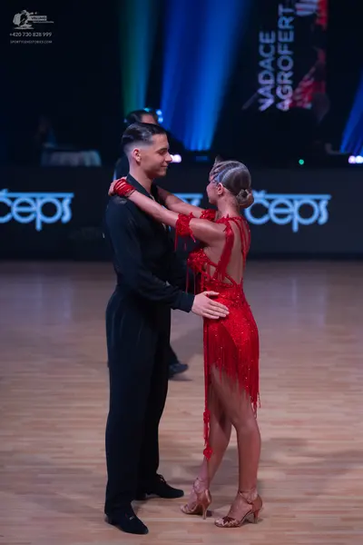 Dancesport competitor: Male dancer: black long-sleeved shirt and black trousers
