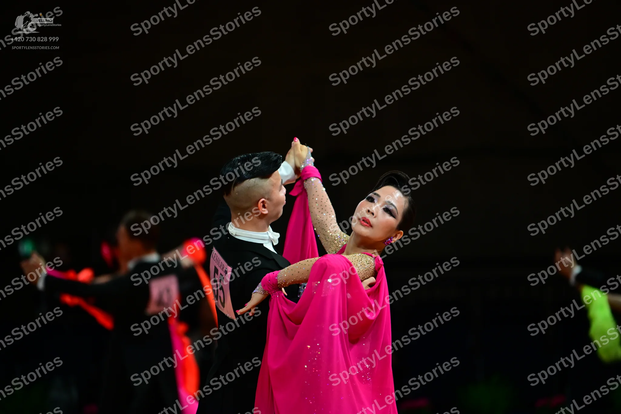 Dancesport competitor #55: Male dancer: black long-sleeved shirt with a white collar