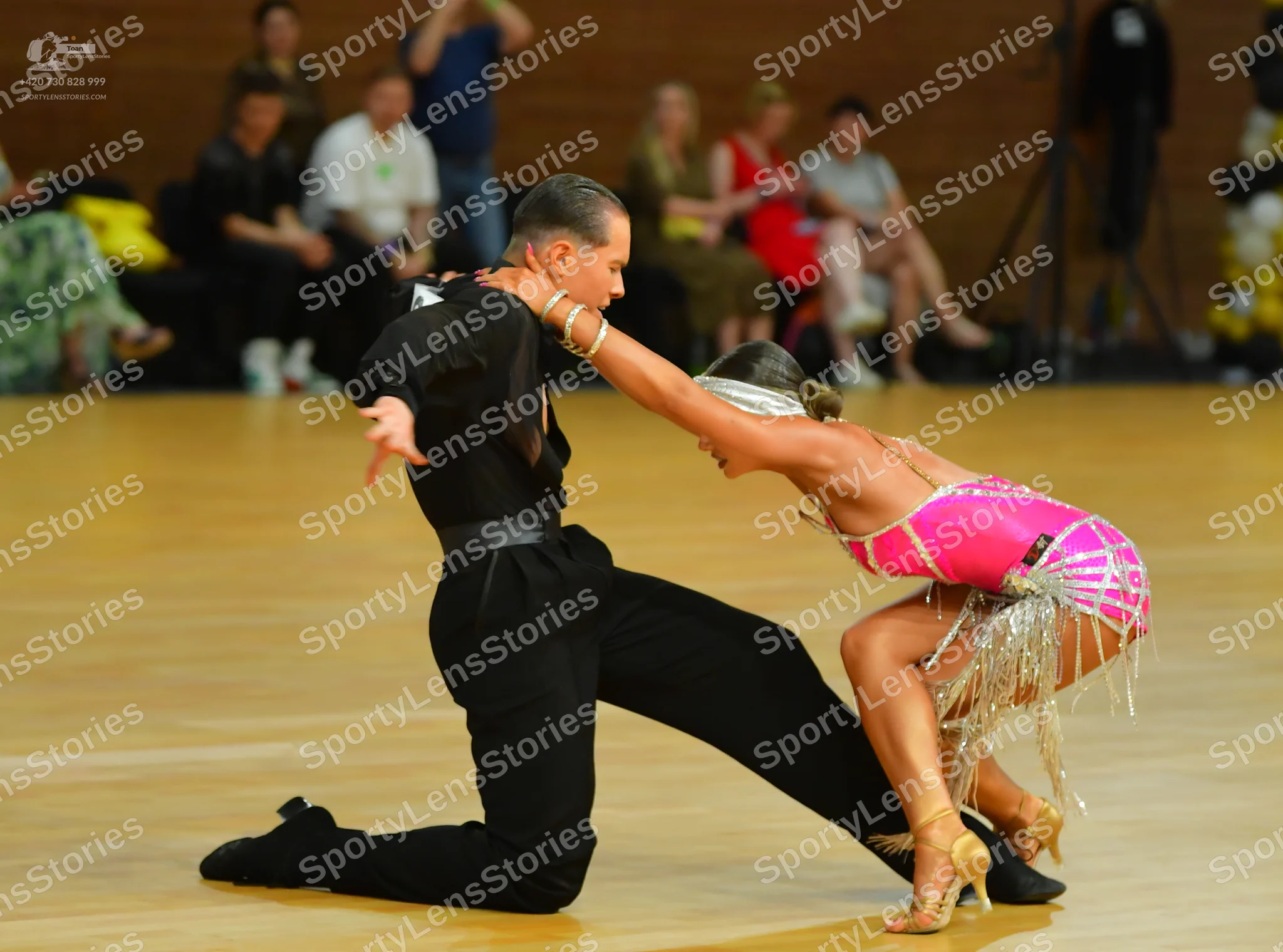 Dancesport competitor: Male dancer: black long-sleeved shirt and black trousers