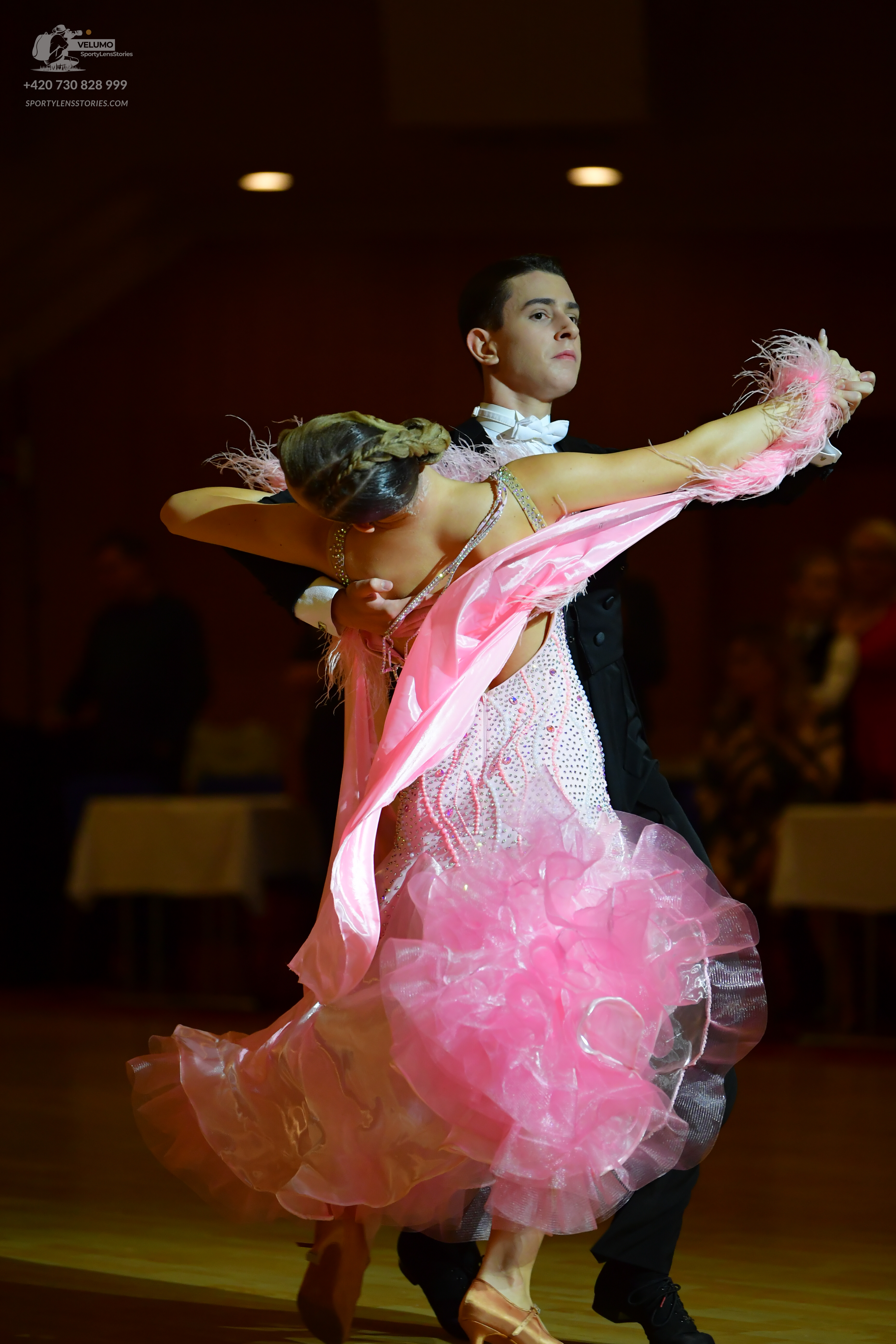 Dancesport competitor: Male dancer: black suit with white shirt and white bow tie