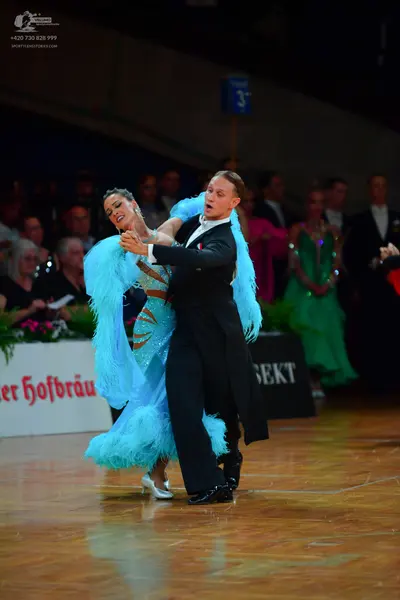 Dancesport competitor: Male dancer: black ballroom tailcoat suit with a white shirt and white bowtie