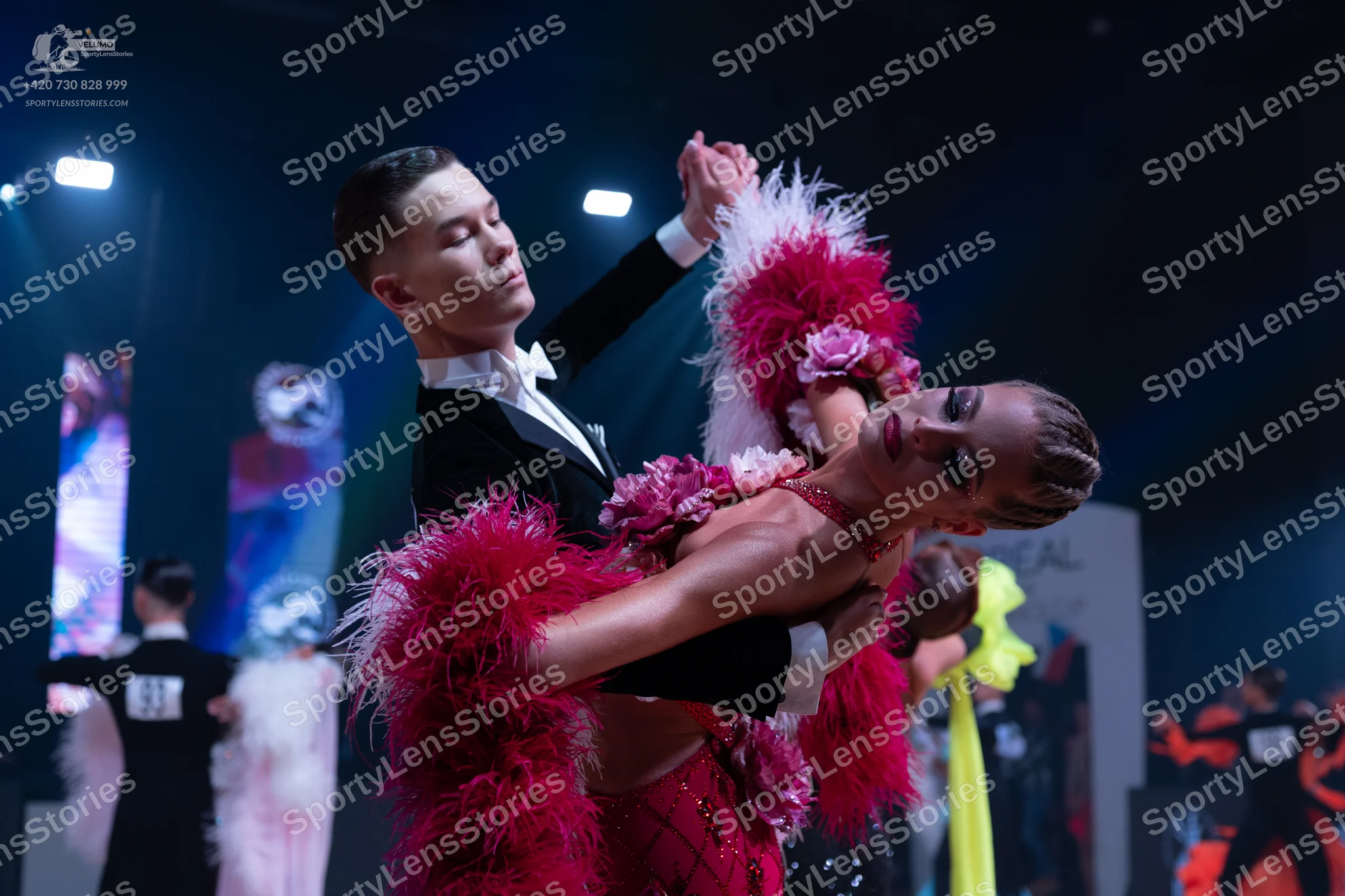 Dancesport competitor: Main male dancer: black suit with a white shirt and white bowtie