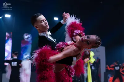 Dancesport competitor: Main male dancer: black suit with a white shirt and white bowtie