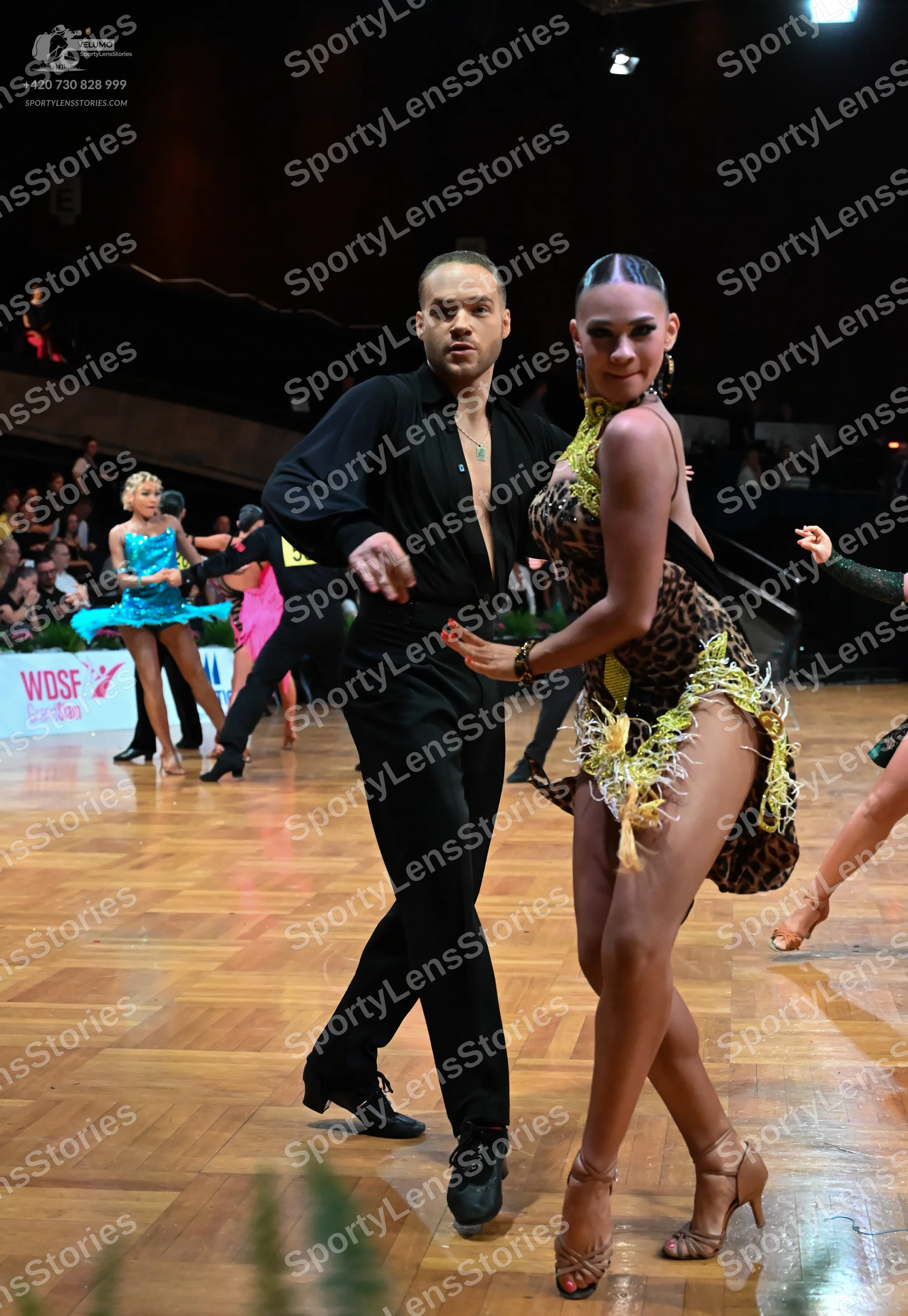 Dancesport competitor: Male dancer: black long-sleeved shirt and black trousers