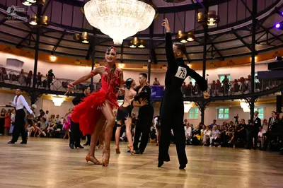 Dancesport competitor #76: Female dancer: red Latin dress with sequins and a ruffled skirt