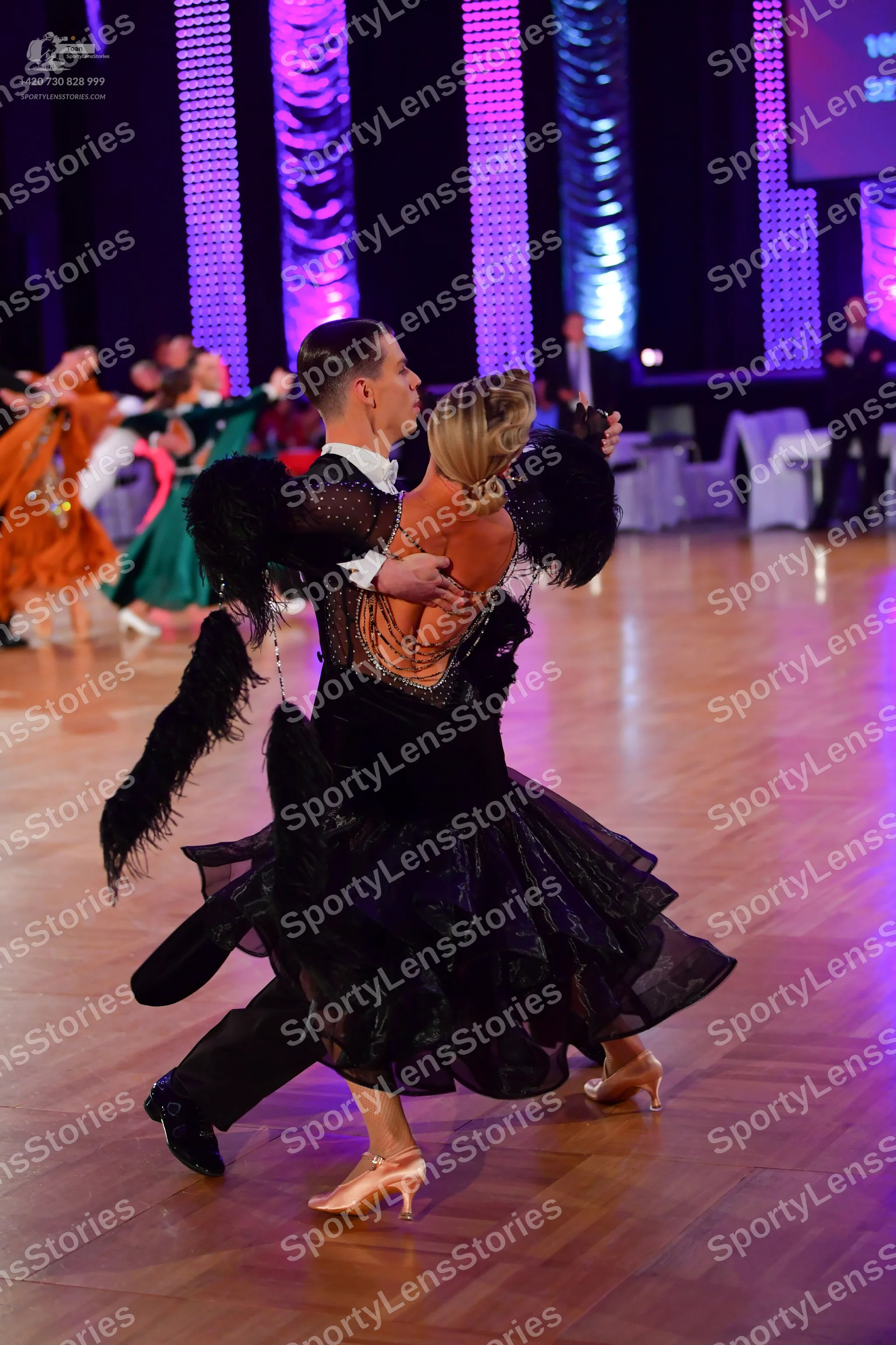 Dancesport competitor: Male dancer: black dance suit with a white shirt