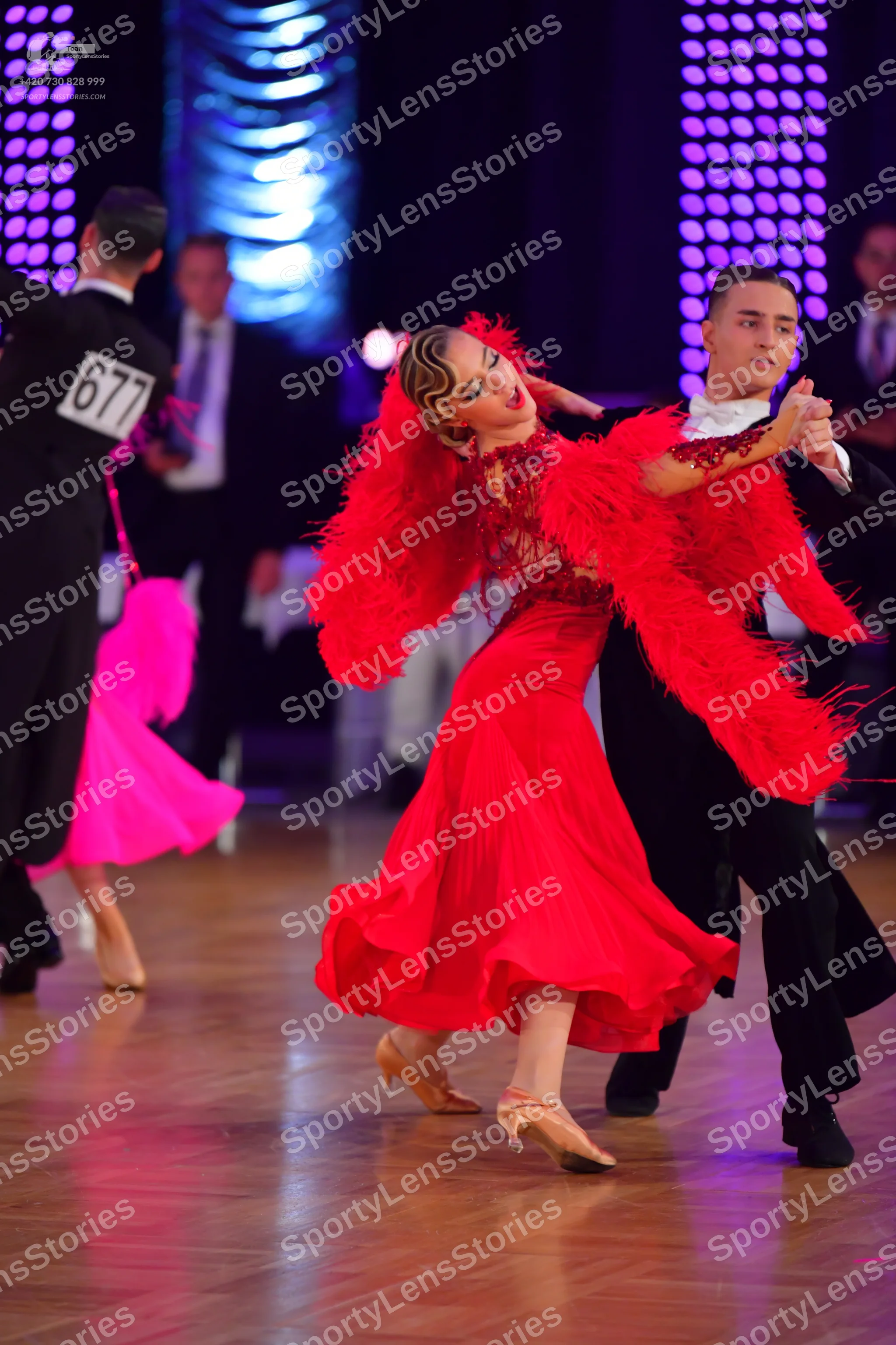Dancesport competitor #677: Male dancer (left): black suit