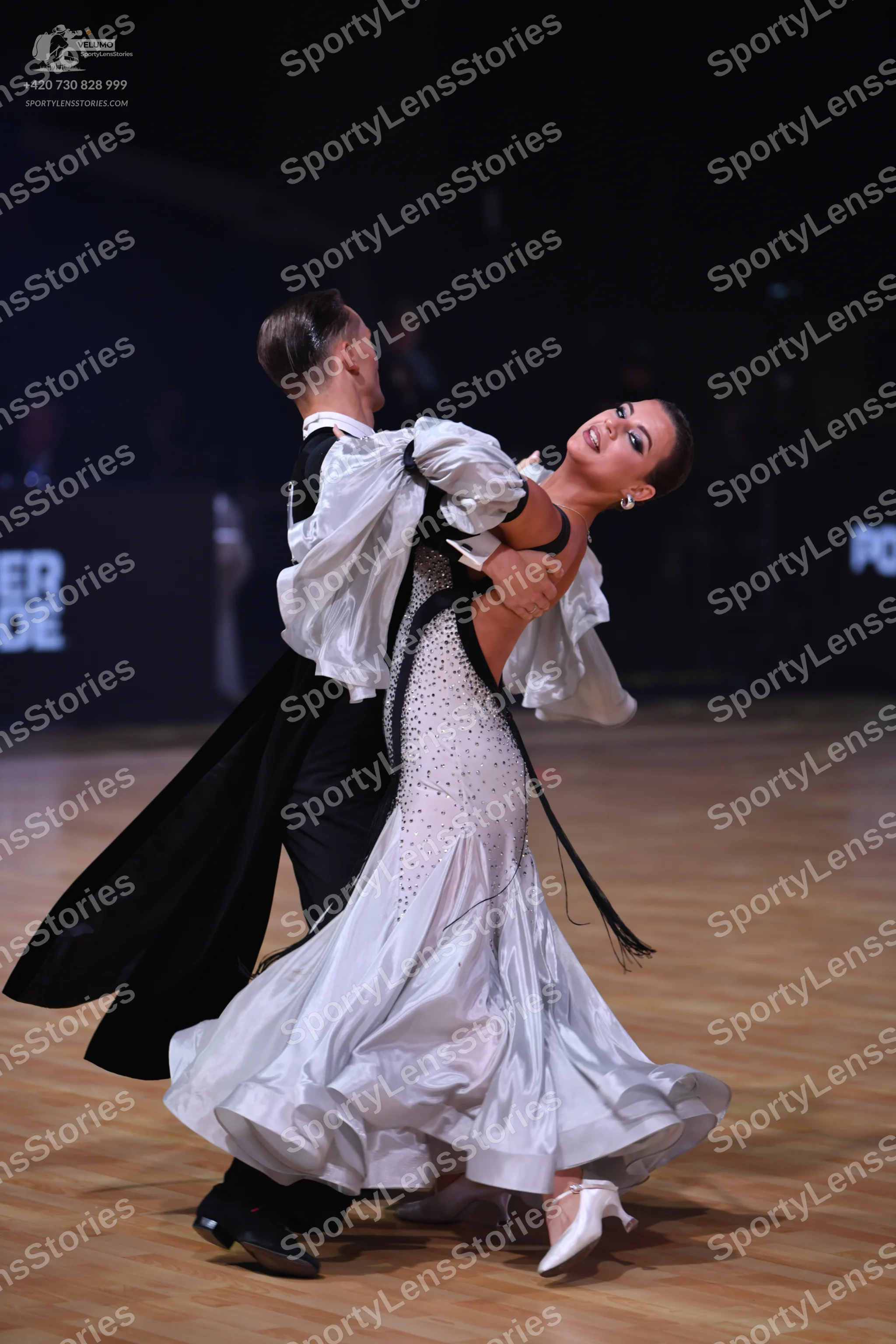 Dancesport competitor: Male dancer: black tailcoat, white shirt with a high collar, black trousers, and