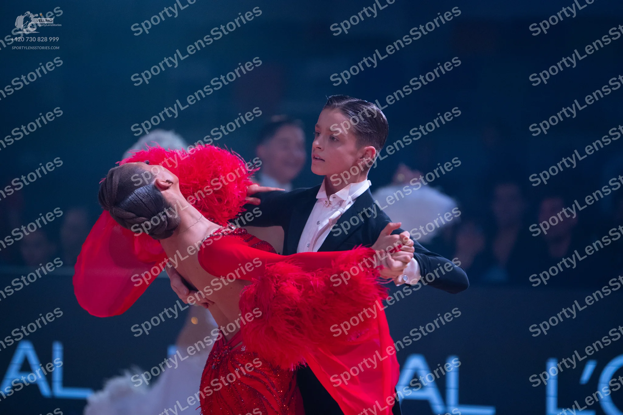 Dancesport competitor: Male dancer: black suit with a white shirt