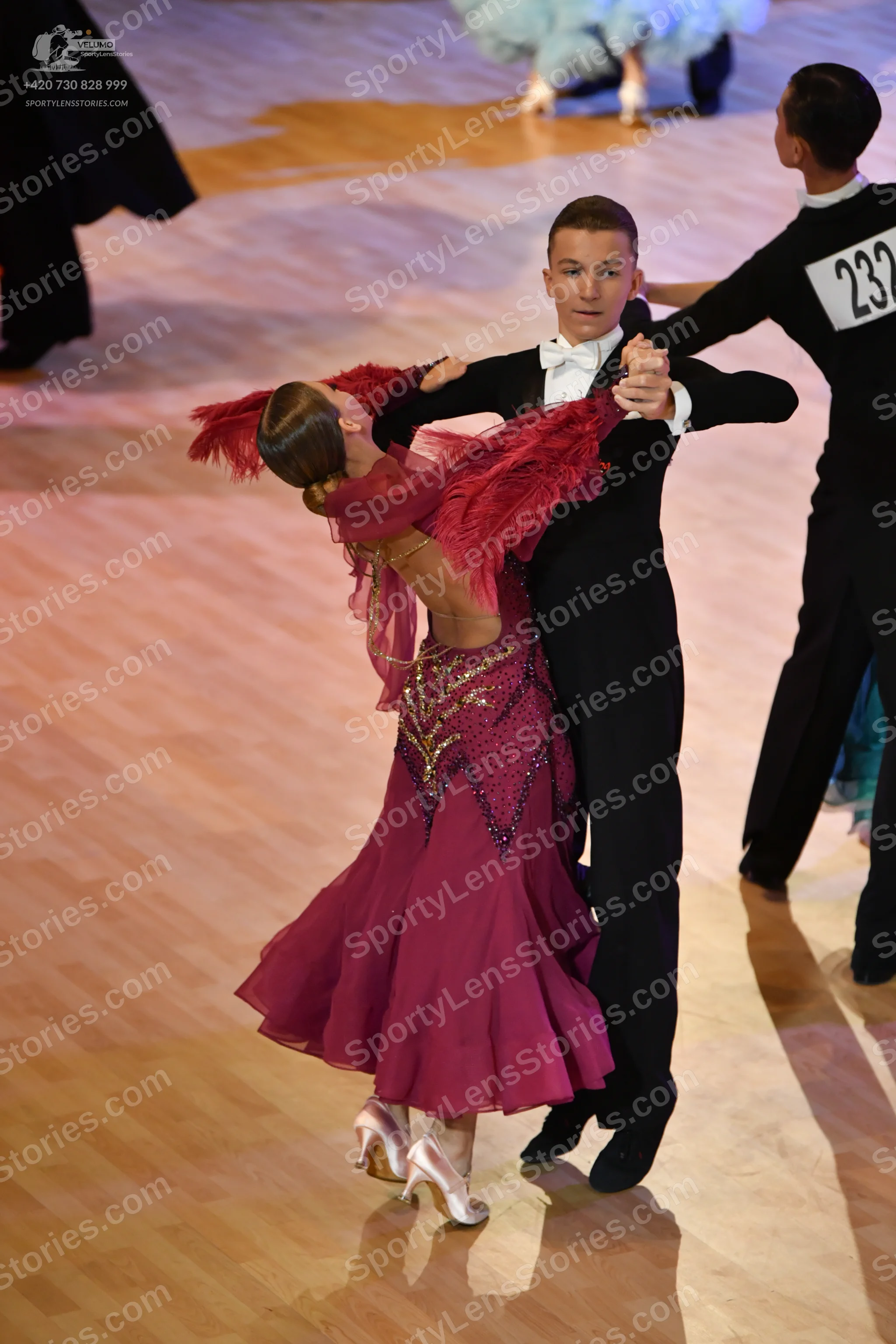 Dancesport competitor: ** Black tail suit with a subtle sequin pattern on the lapels and possibly the s