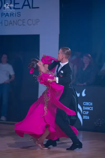 Dancesport competitor: Male dancer: black suit with a white shirt and white bowtie
