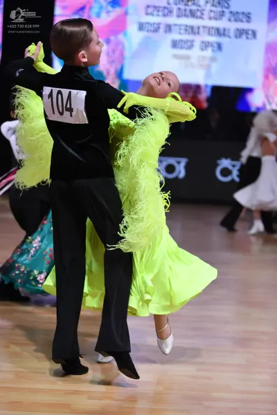 Dancesport competitor: Male dancer: black long-sleeved shirt and black trousers