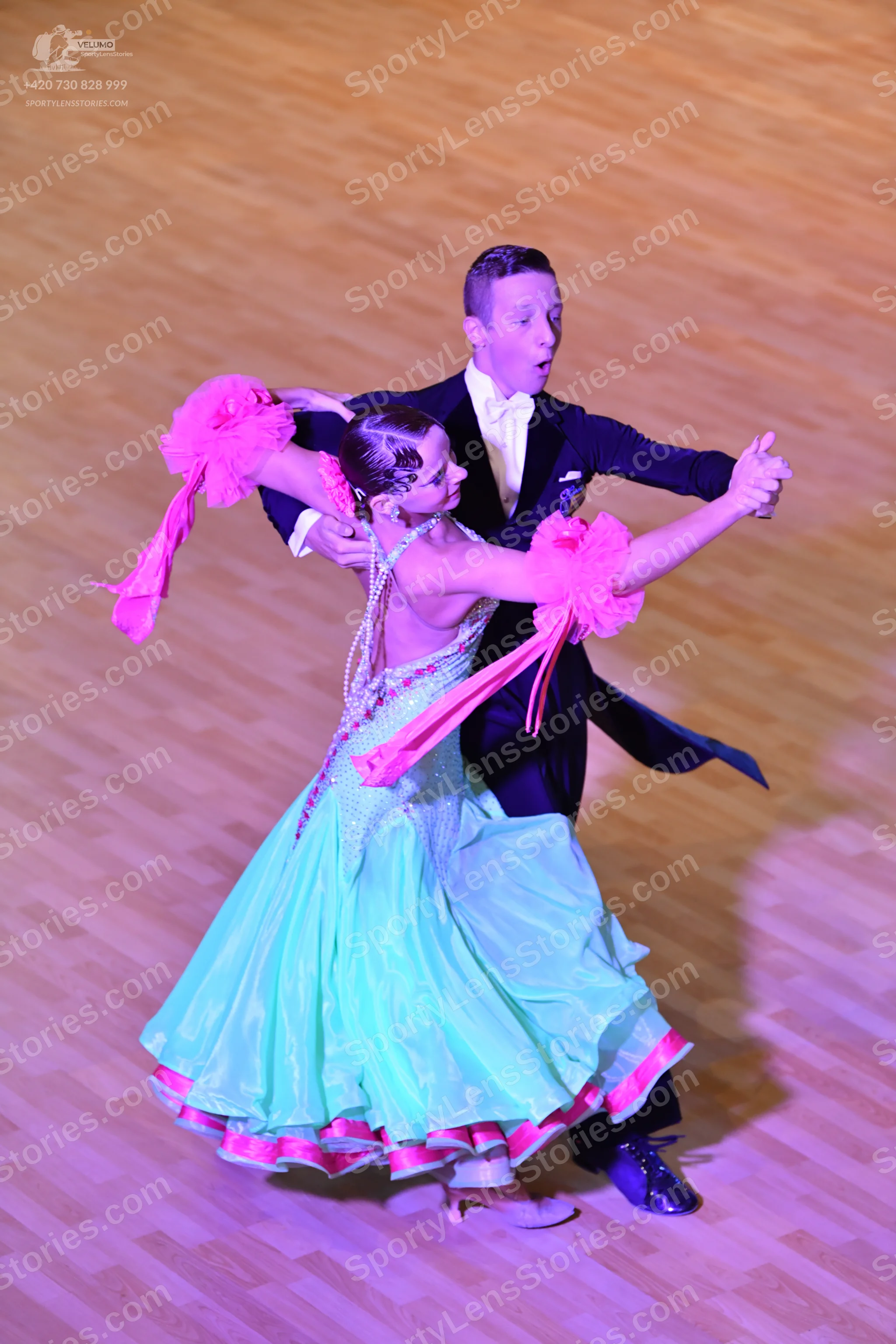 Dancesport competitor: Male dancer: black tailcoat, white shirt, and white bowtie