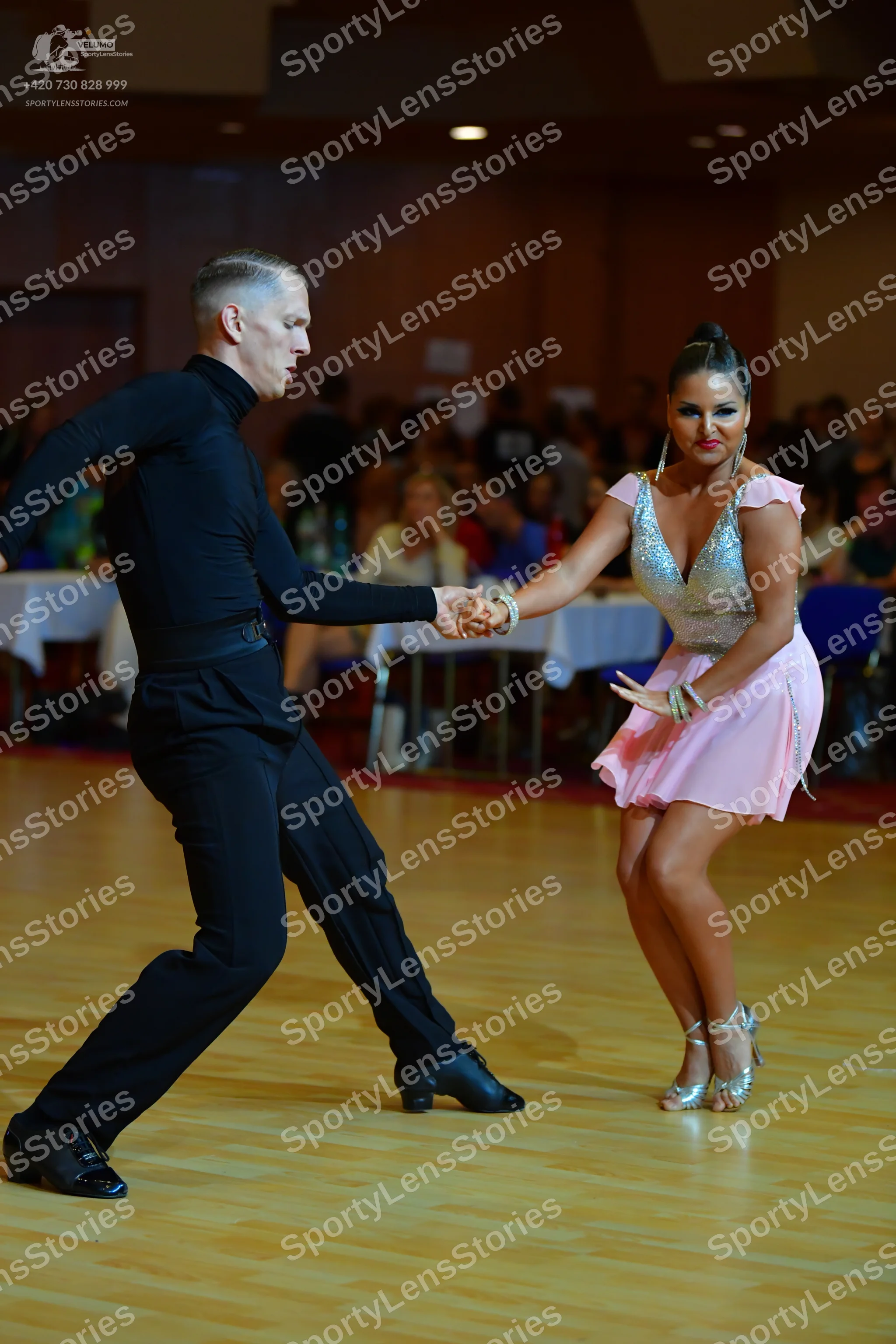Dancesport competitor: Male dancer: black long-sleeved top and black trousers