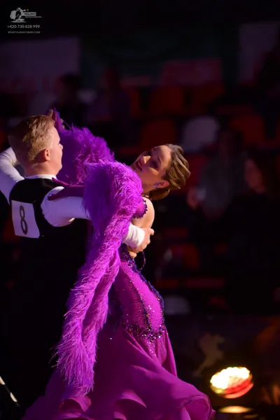 Dancesport competitor: Male dancer: black waistcoat over a white long-sleeved shirt