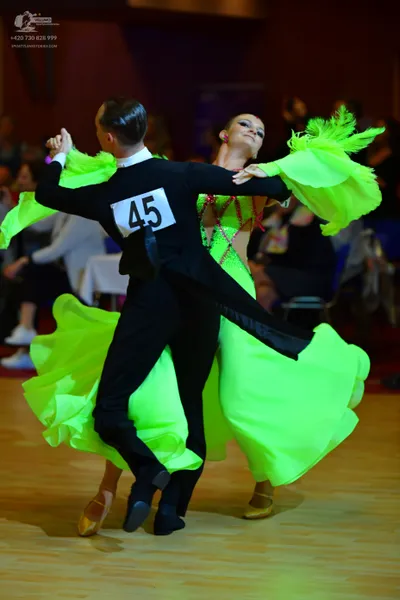Dancesport competitor #45: Male dancer: black tailcoat suit with a white shirt collar