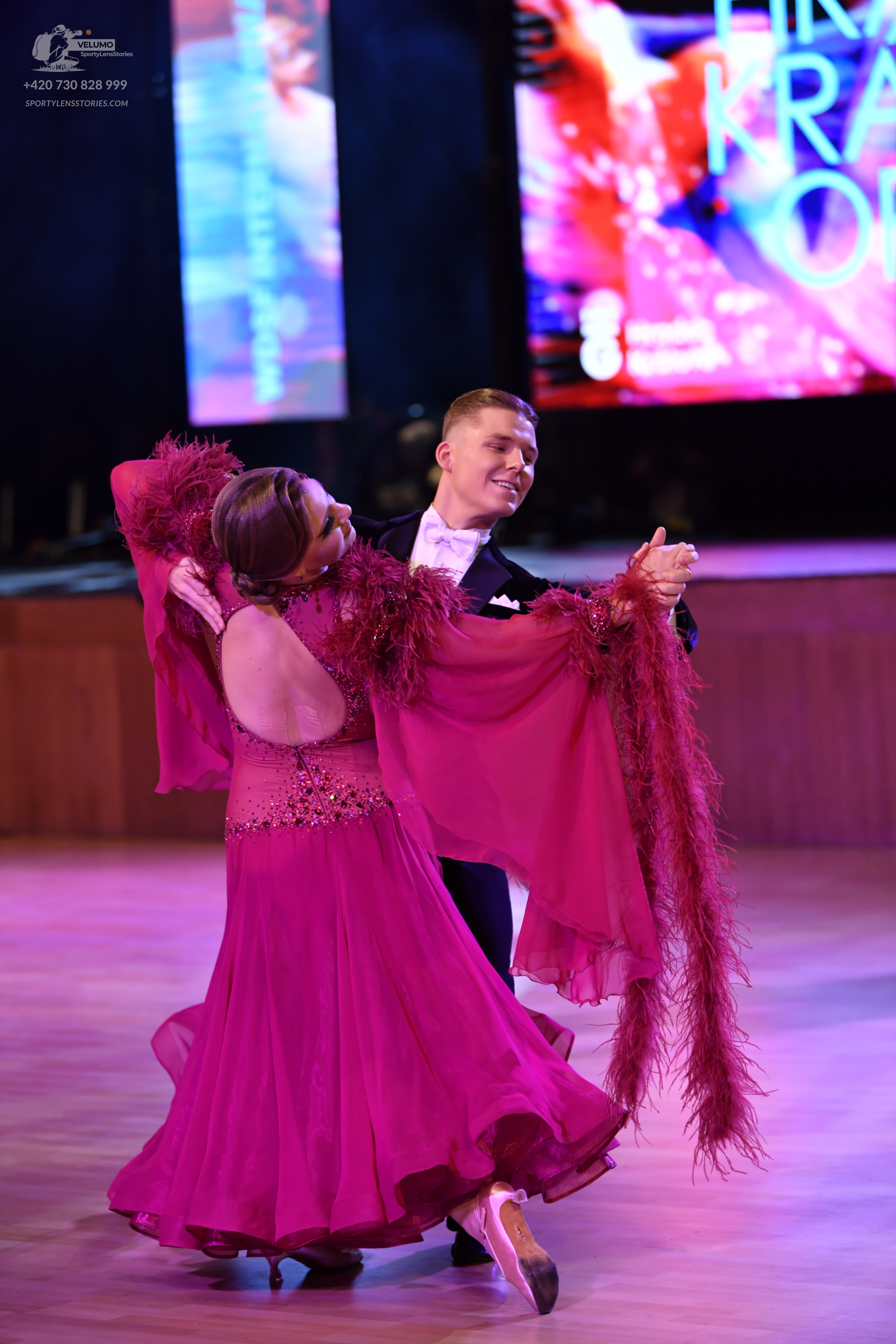 Dancesport competitor: Male dancer: dark suit with a white shirt and bowtie