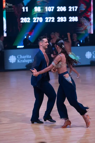 Dancesport competitor: Male dancer: dark navy blue suit jacket and trousers, worn without a shirt