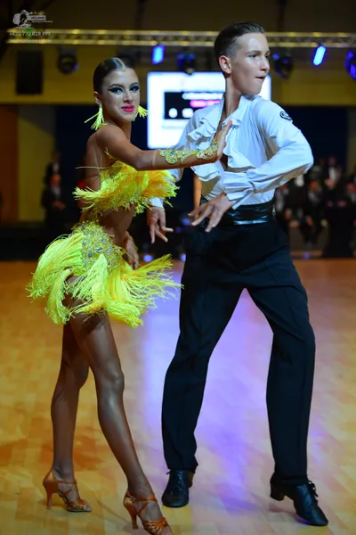Dancesport competitor: ** Male: Black tail suit with a subtle sequin pattern on the lapels and cuffs